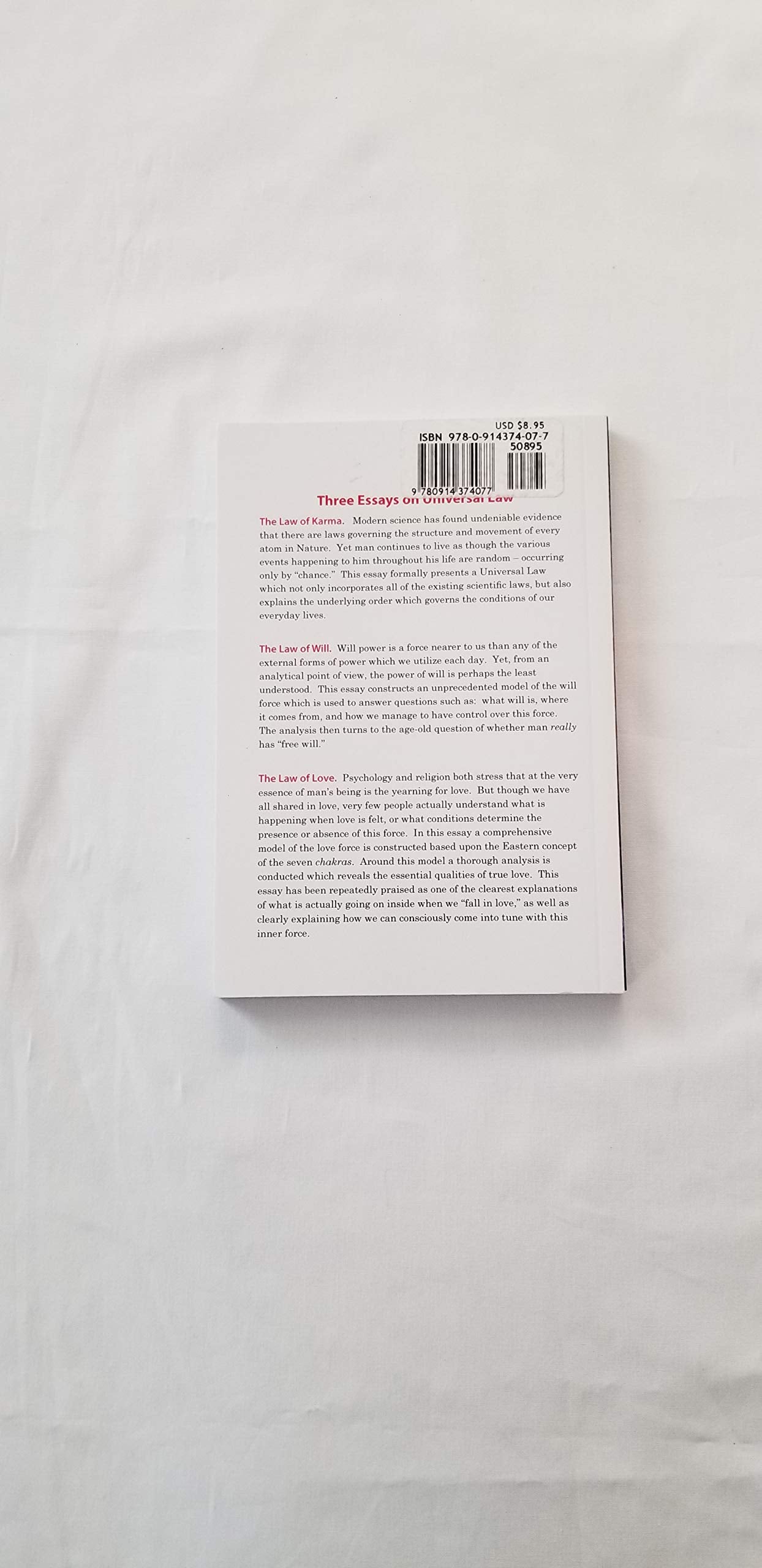 Three essays on universal law: The laws of Karma, will, and love