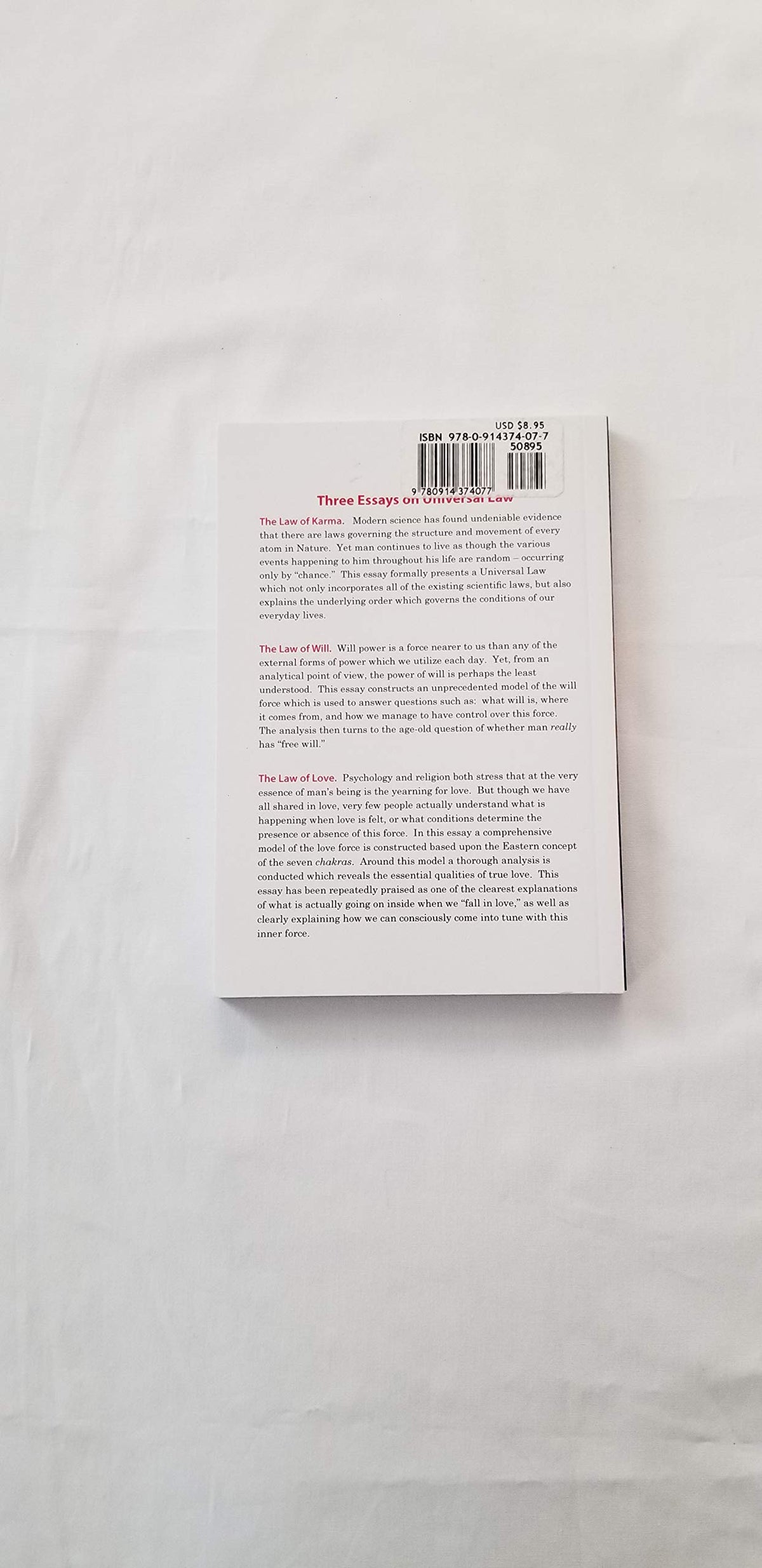 Three essays on universal law: The laws of Karma, will, and love