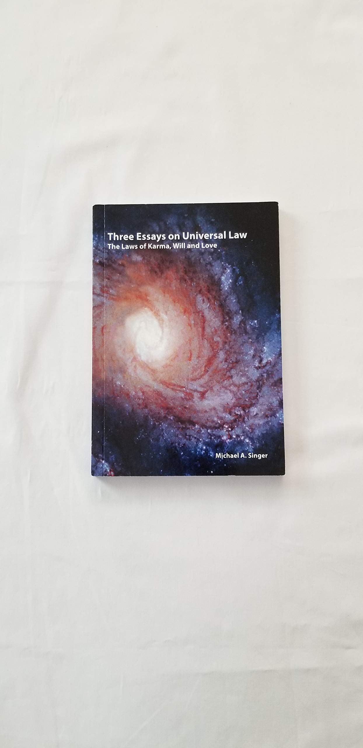 Three Essays on Universal Law: Laws of Karma, Will