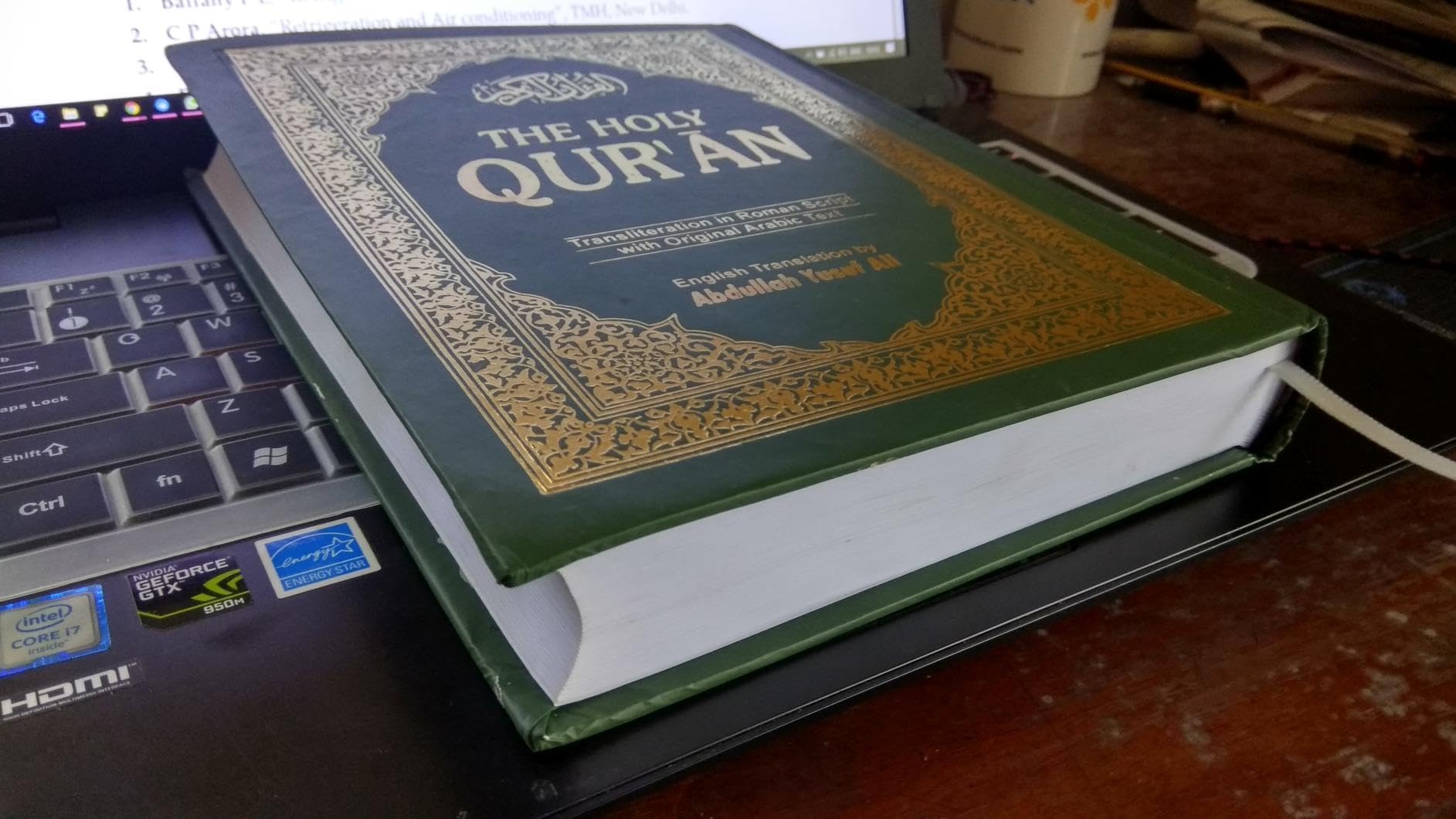 The Holy Qur'an: Roman Transliteration, with orginal Arabic Text and English translation