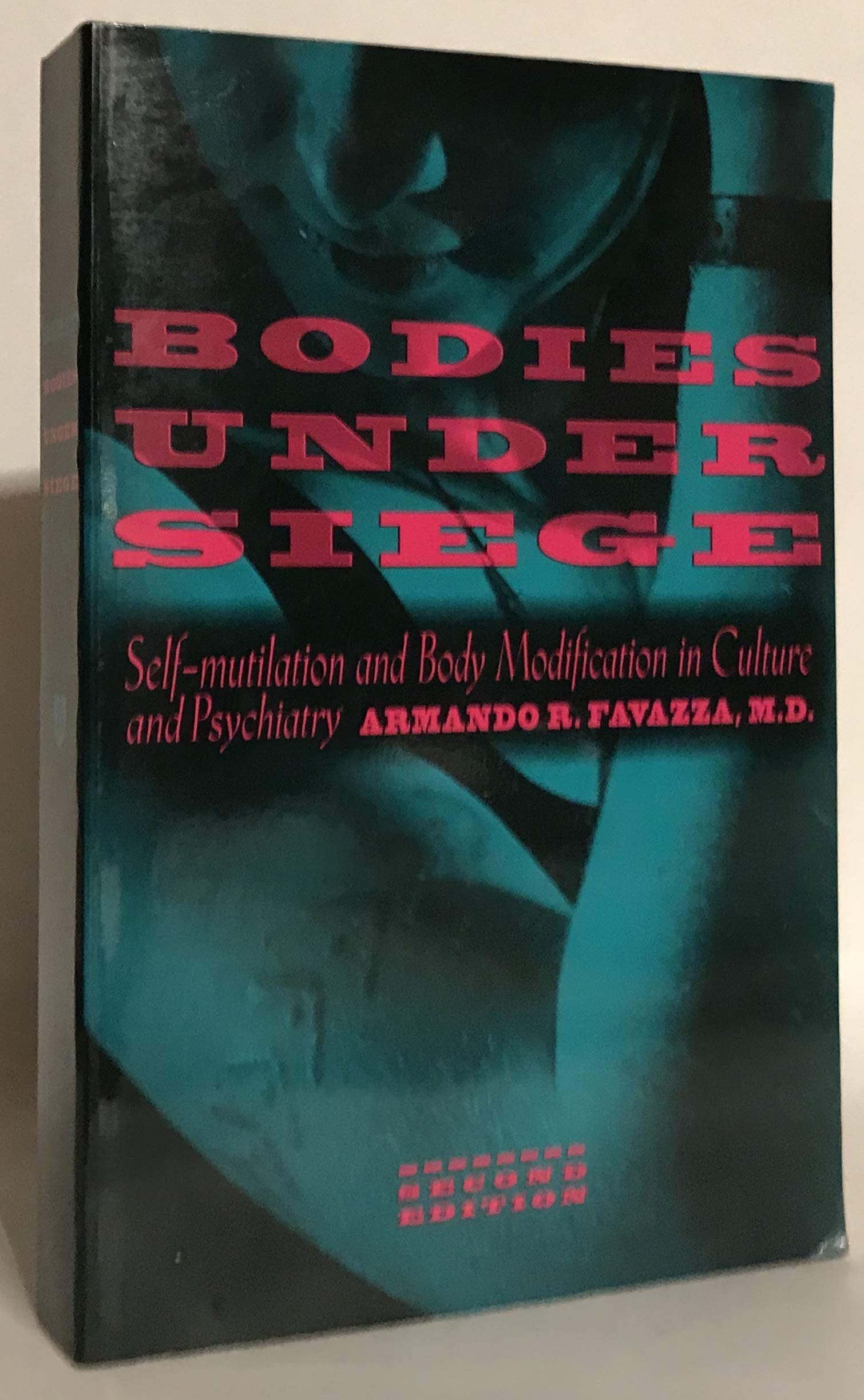 Bodies under Siege: Self-mutilation and Body Modification in Culture and Psychiatry