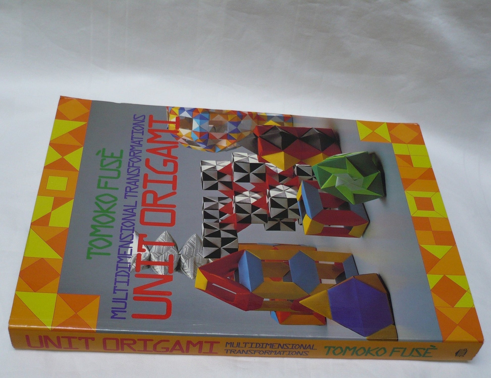 Unit Origami: Multidimensional Transformations