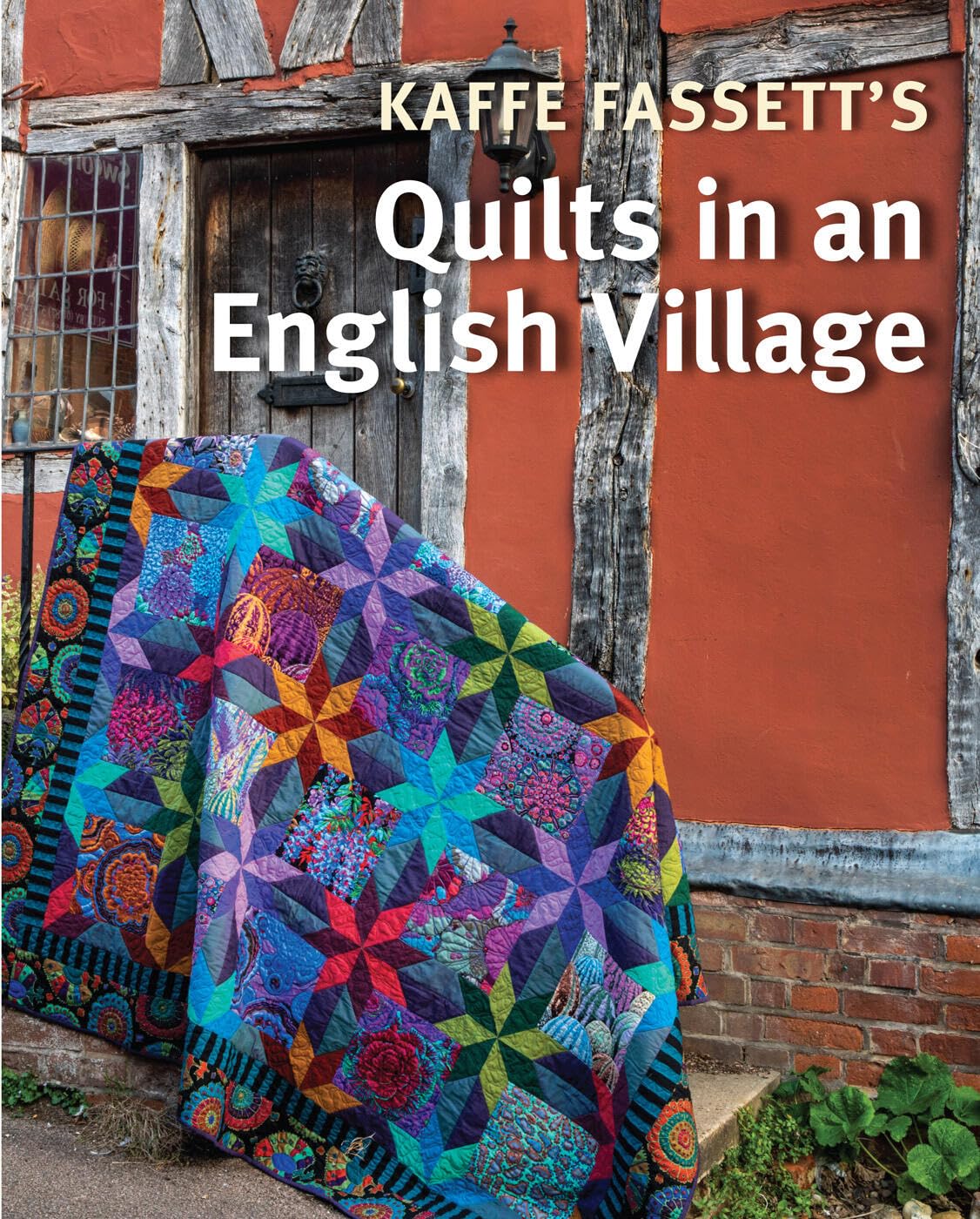Kaffe Fassett's Quilts in an English Village: New quilt designs photographed against English village backdrops for color-soaked inspiration.