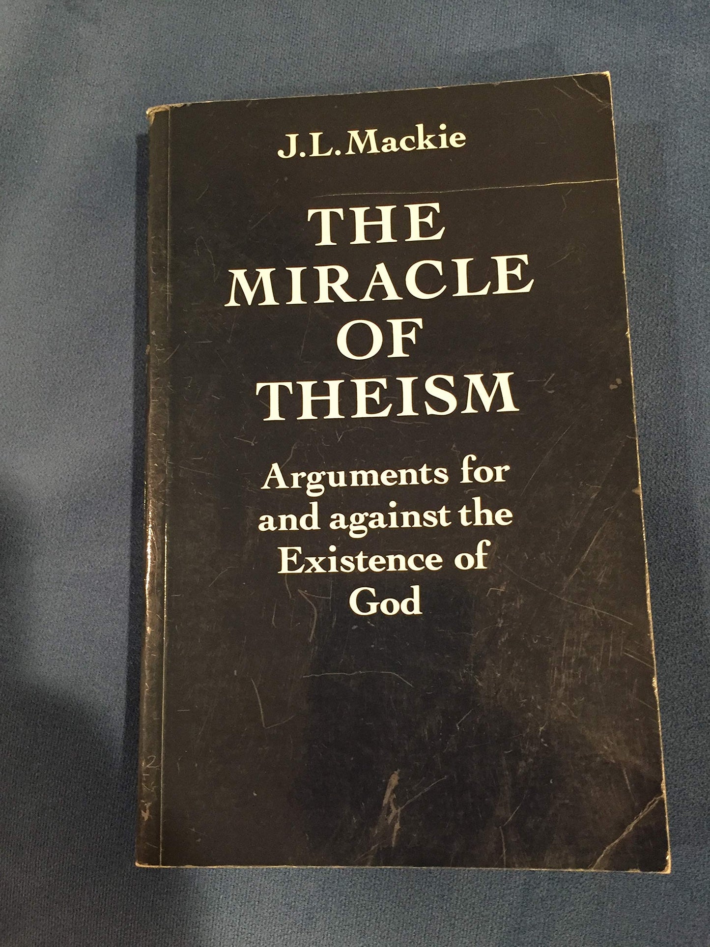 The Miracle of Theism: Arguments For and Against the Existence of God